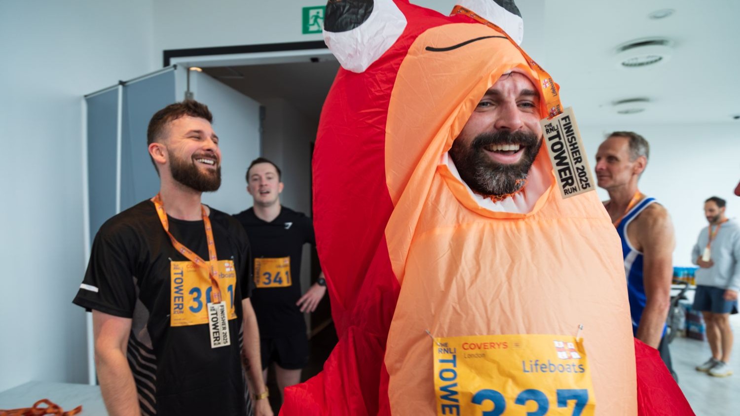 A participant of the RNLI Tower Run wearing a lobster costume.